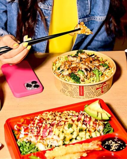 Edo Japan Chicken Teriyaki Bowl and Poke Bento Close-up of Edo Japan chicken teriyaki bowl with broccoli and noodles, alongside a colorful poke bento with avocado and tempura.