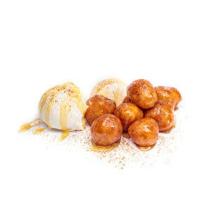 Golden donut holes with powdered sugar on white background – dessert menu photography Toronto