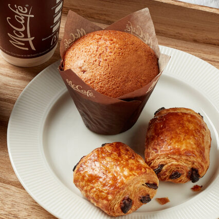 A delectable muffin and freshly brewed coffee, beautifully captured by our social media photographer.