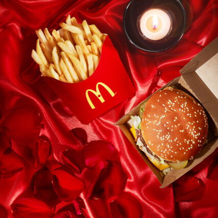 A burger nestled within a Valentine-themed setting. A perfect sample of our social media content creation